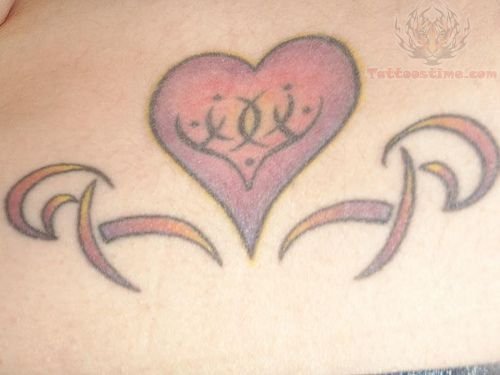 Tribal Design And Color Heart Tattoo On Lower Back